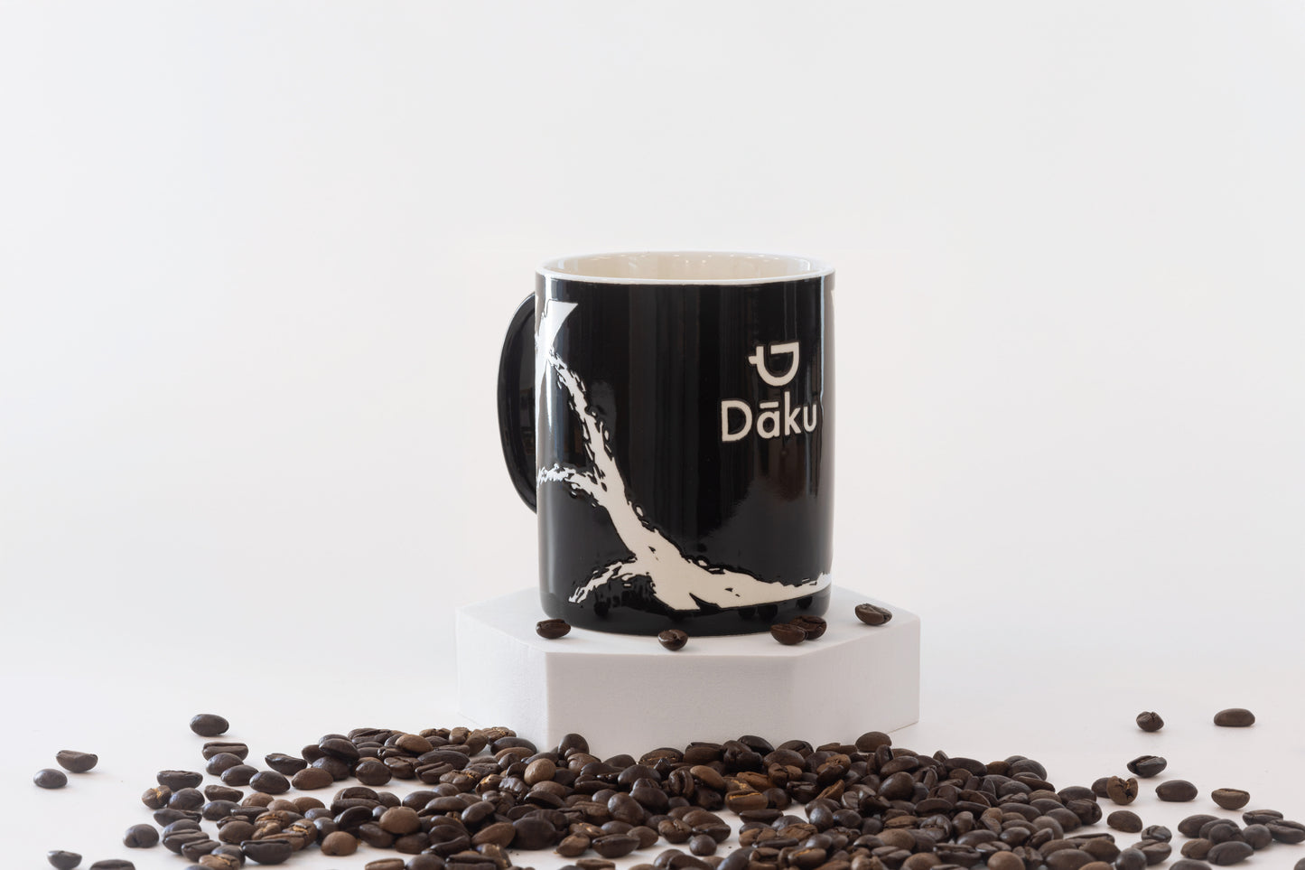 Dāku ceramic coffee mug, black with white logo